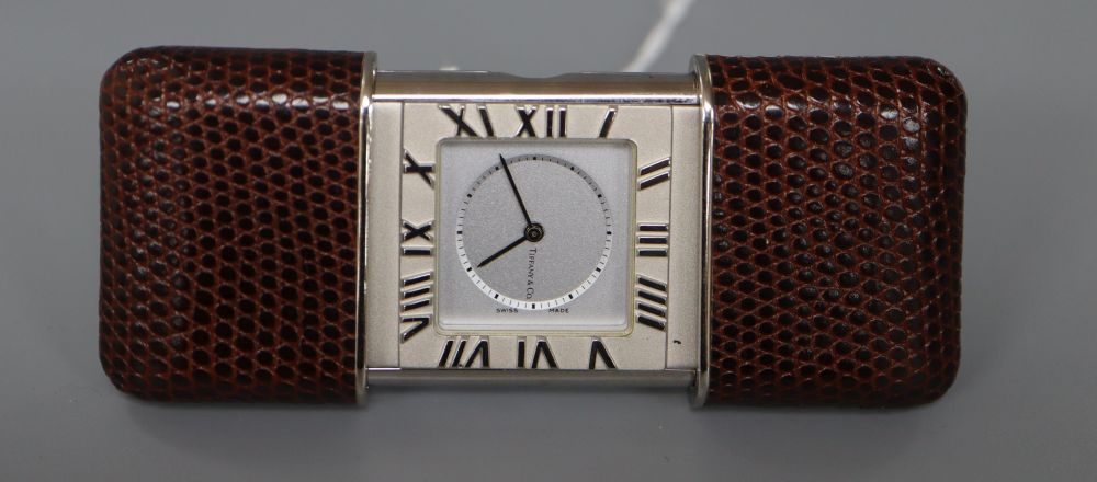 Tiffany & Co. A stainless steel and leather mounted purse alarm watch,